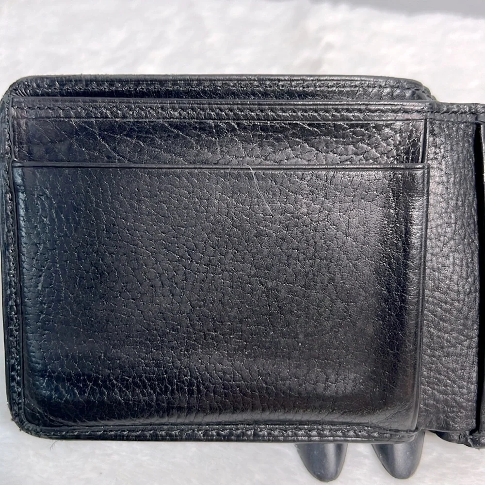 Tumi black leather